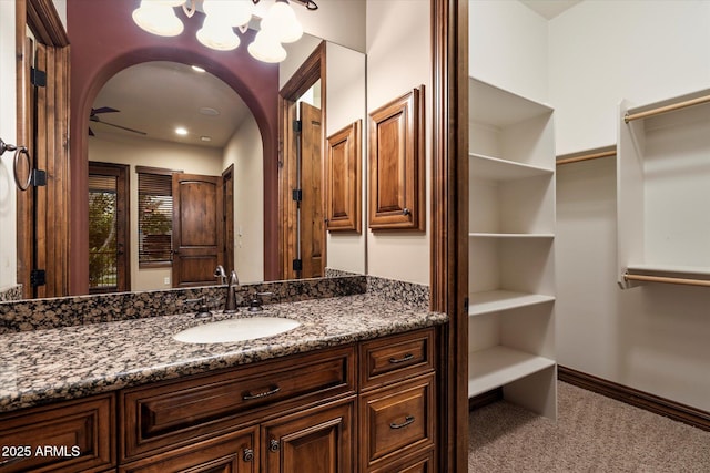 3523 E Presidio Cir, Mesa, AZ 85213 - bathroom with a chandelier, vanity, and baseboards