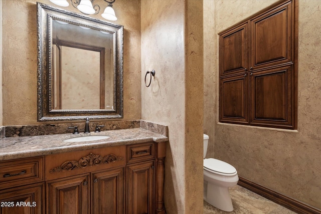 3523 E Presidio Cir, Mesa, AZ 85213 - bathroom featuring toilet, vanity, and a textured wall