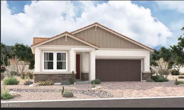 view of front of home with stone siding, an attached garage, and decorative driveway