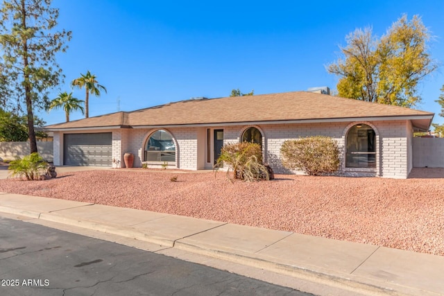 ranch-style home with a garage