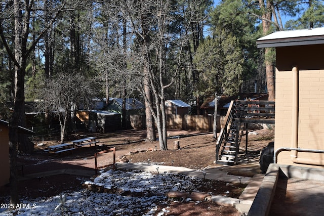 view of yard featuring stairs and a fenced backyard