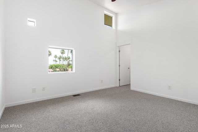 1111 W University Dr Unit 3016, Tempe, AZ 85281 - carpeted spare room with a towering ceiling, plenty of natural light, baseboards, and ceiling fan