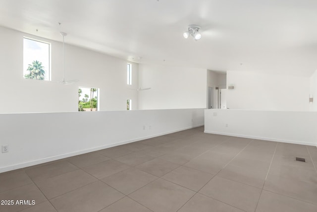 1111 W University Dr Unit 3016, Tempe, AZ 85281 - spare room featuring light tile patterned floors and baseboards