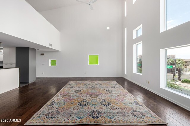 1111 W University Dr Unit 3016, Tempe, AZ 85281 - living area featuring a high ceiling, dark wood-type flooring, baseboards, and ceiling fan