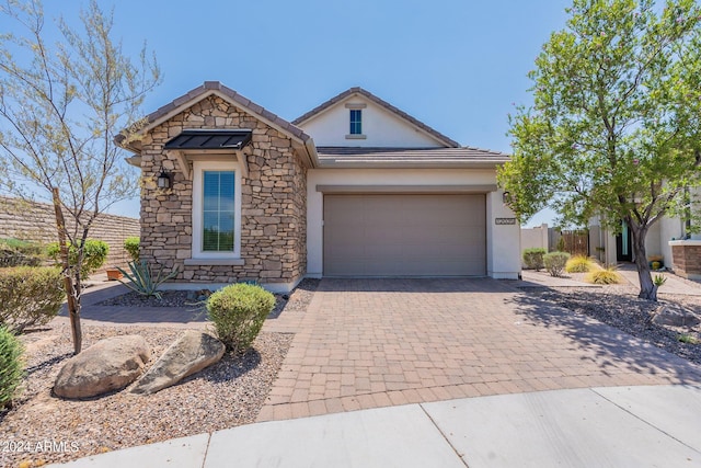 view of front of property with a garage