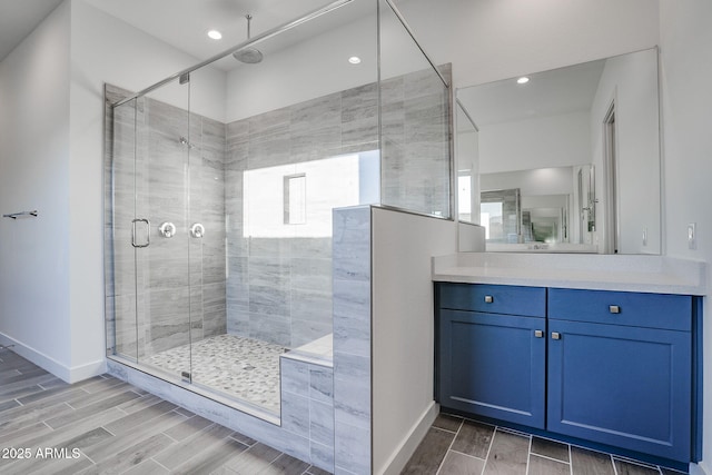 11534 N Jerome St, Surprise, AZ 85388 - full bathroom featuring a stall shower, vanity, wood tiled floors, baseboards, and recessed lighting