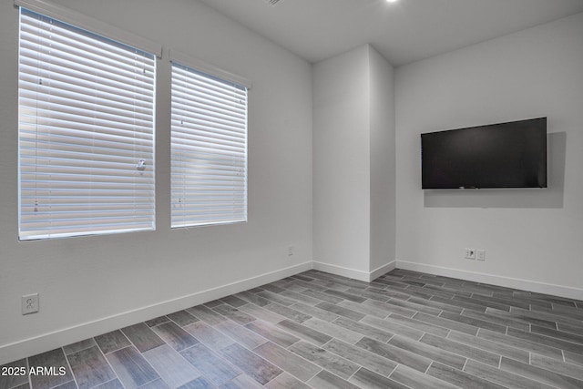 11534 N Jerome St, Surprise, AZ 85388 - spare room with baseboards and wood finished floors