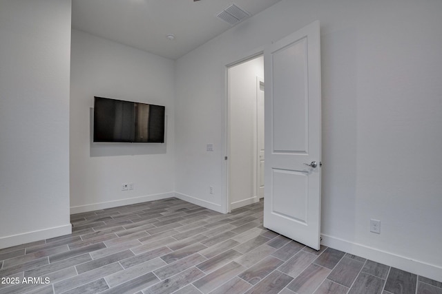 11534 N Jerome St, Surprise, AZ 85388 - unfurnished room with wood finished floors and baseboards