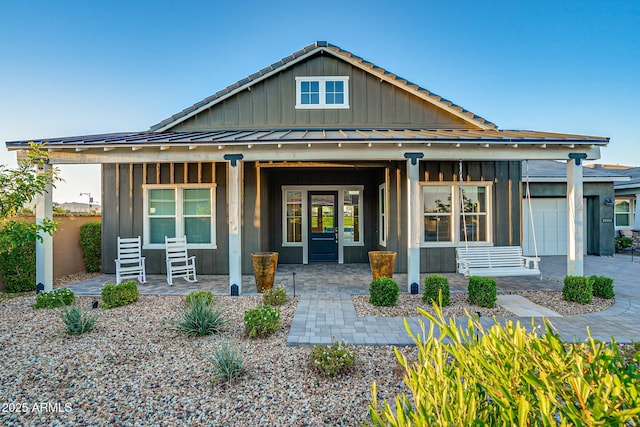 11534 N Jerome St, Surprise, AZ 85388 - view of front of home with a porch and board and batten siding