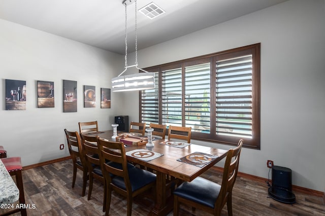 dining area with dark hardwood / wood-style floors