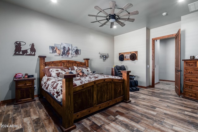 bedroom featuring ceiling fan and dark hardwood / wood-style flooring