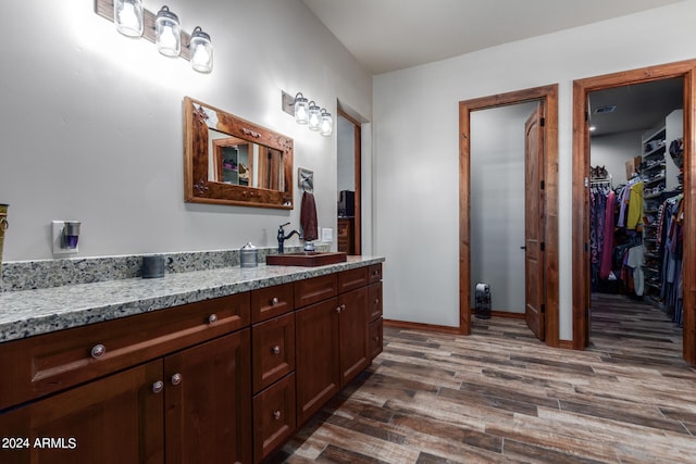 bathroom featuring vanity and wood-type flooring