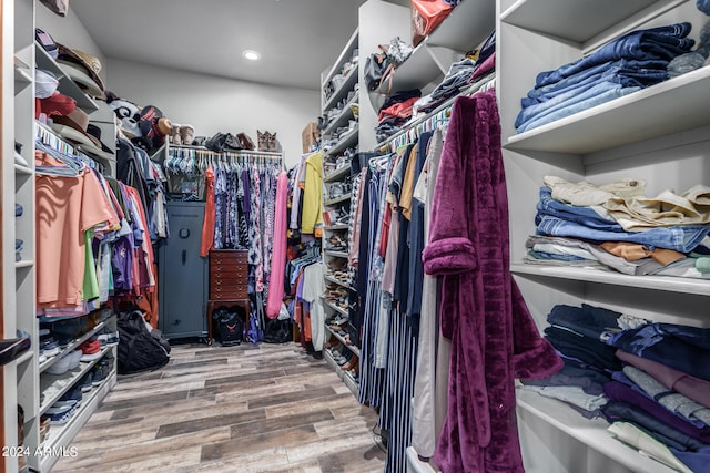 spacious closet featuring hardwood / wood-style floors