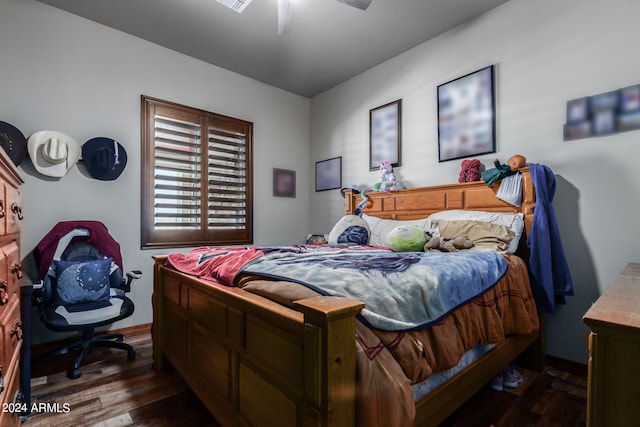 bedroom featuring ceiling fan and dark hardwood / wood-style flooring