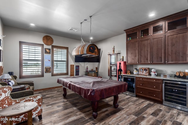 game room with pool table, dark hardwood / wood-style floors, bar area, and beverage cooler