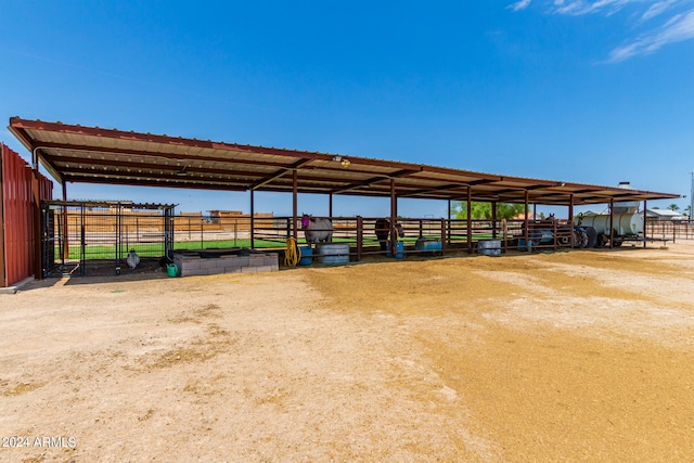 view of vehicle parking featuring a rural view