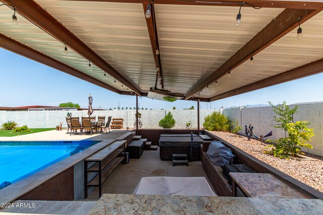 view of patio with a fenced in pool