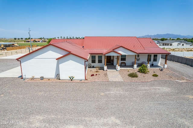 view of front facade featuring a mountain view and a porch