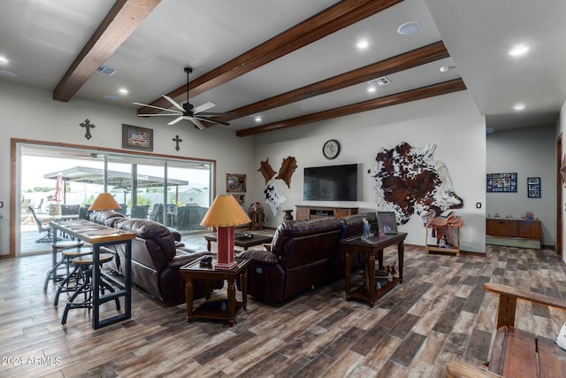 living room with dark wood-type flooring, ceiling fan, and beam ceiling