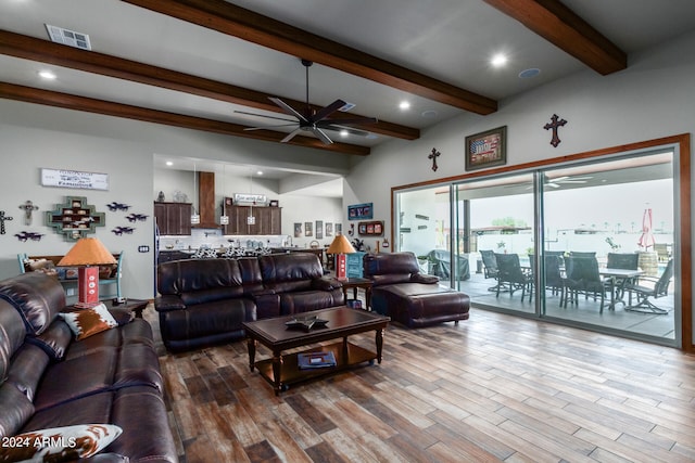 living room with beamed ceiling, hardwood / wood-style floors, and ceiling fan