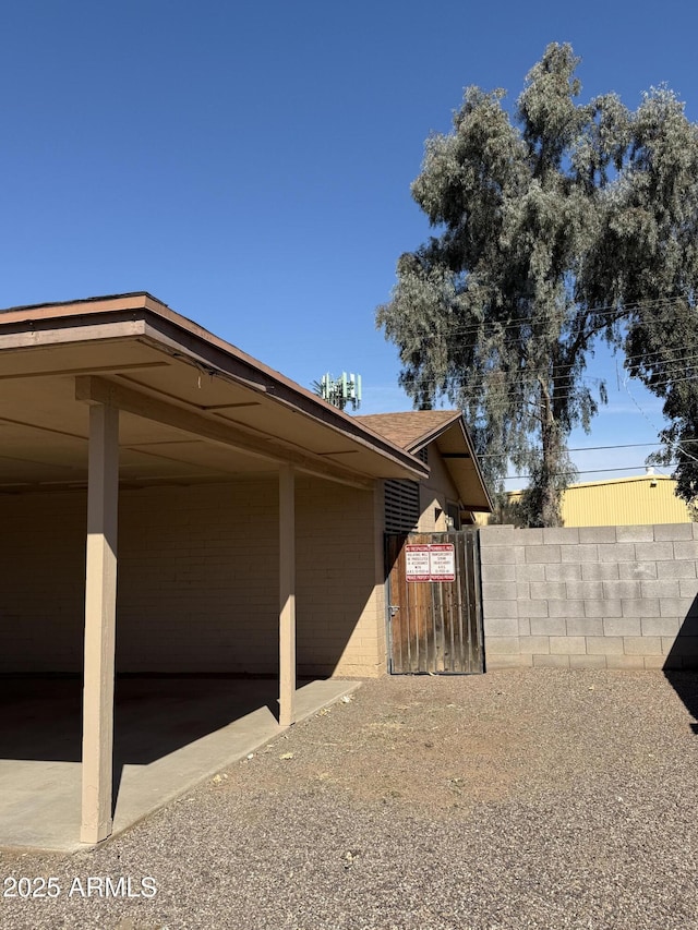 view of home's exterior featuring fence