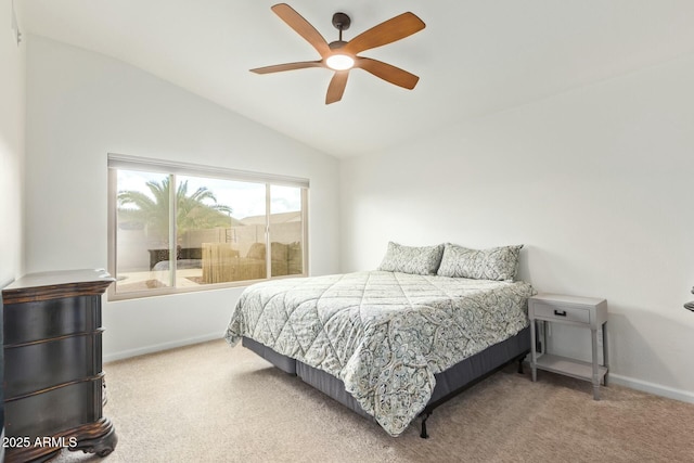 carpeted bedroom featuring a ceiling fan, lofted ceiling, and baseboards