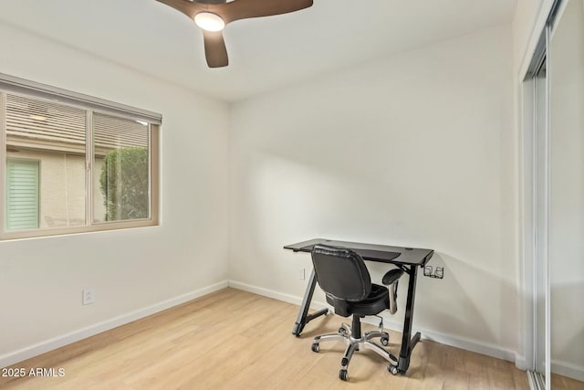 office area featuring ceiling fan, wood finished floors, and baseboards