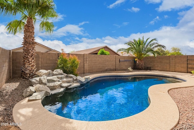 view of swimming pool with a fenced backyard and a fenced in pool