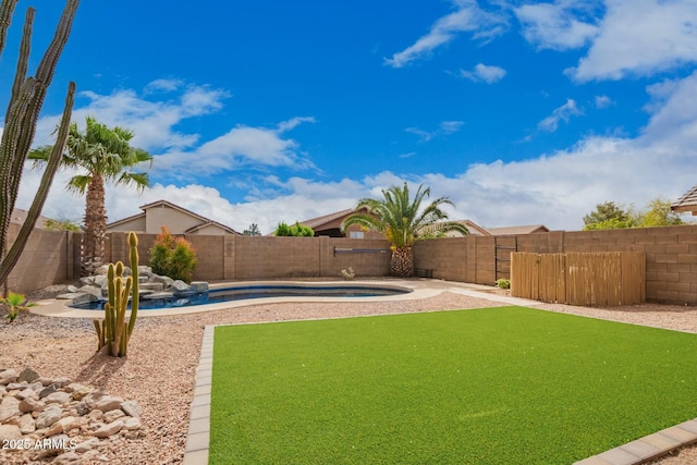 view of yard with a fenced in pool and a fenced backyard