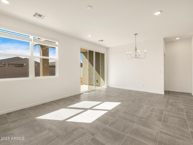 unfurnished room with a chandelier, baseboards, visible vents, and recessed lighting