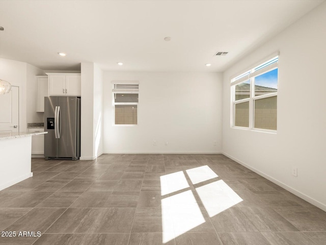 interior space featuring baseboards, visible vents, and recessed lighting