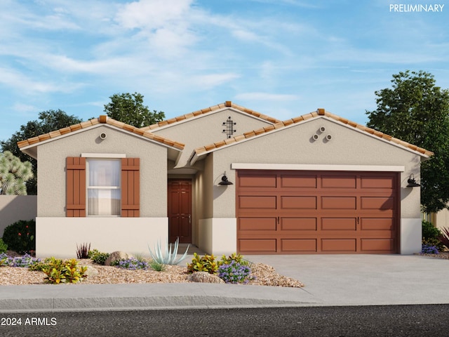 mediterranean / spanish-style home with concrete driveway, a tile roof, an attached garage, and stucco siding