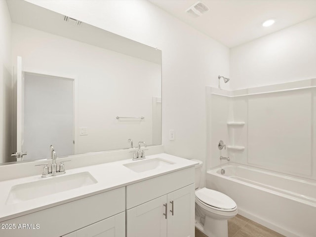 bathroom with visible vents, a sink, and bathing tub / shower combination