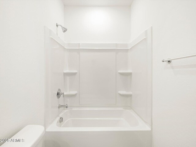 full bath featuring toilet and bathing tub / shower combination