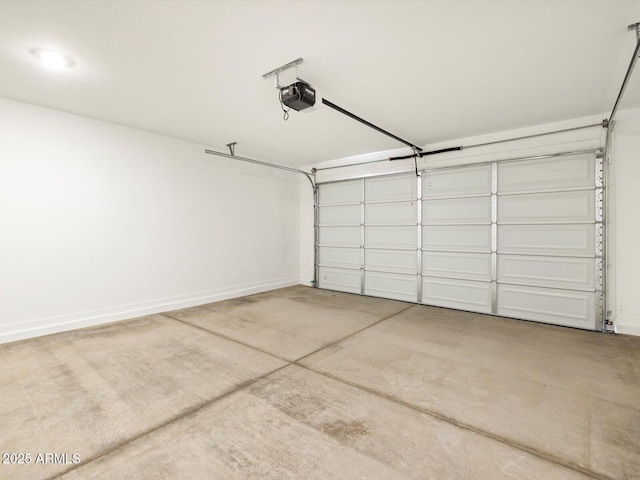 garage featuring baseboards and a garage door opener