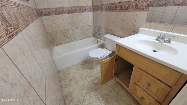 full bathroom with washtub / shower combination, tile walls, vanity, tile patterned floors, and toilet