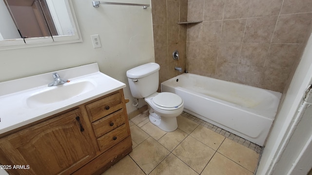 full bathroom with tile patterned flooring, vanity, tiled shower / bath, and toilet