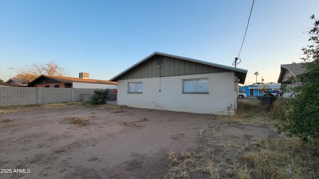 view of back house at dusk