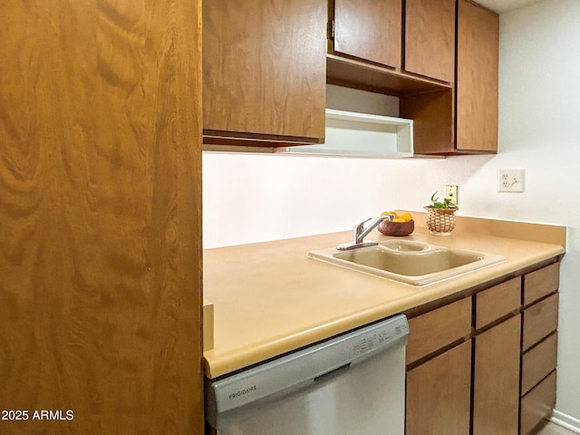 kitchen with sink and stainless steel dishwasher