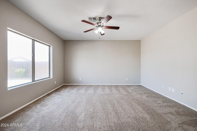 carpeted empty room with ceiling fan