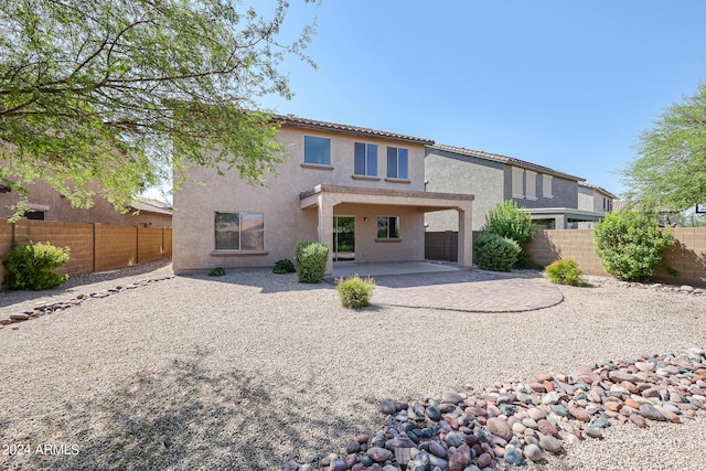 rear view of house with a patio