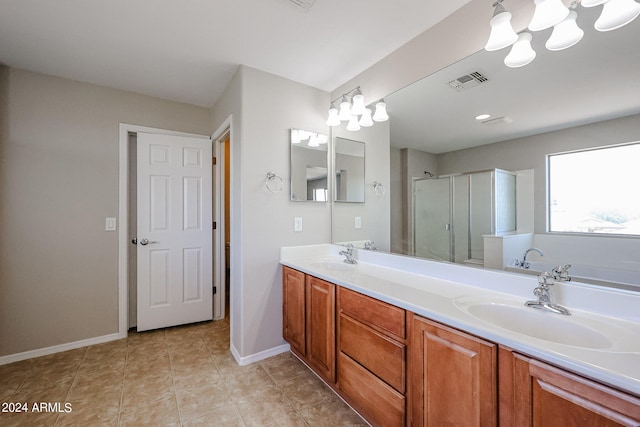 bathroom with tile patterned floors, separate shower and tub, and vanity