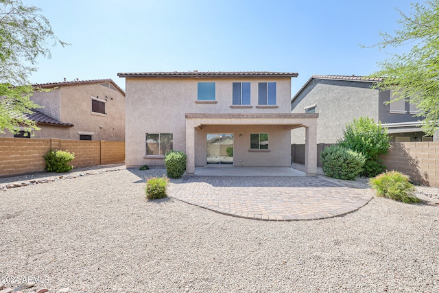 rear view of house with a patio