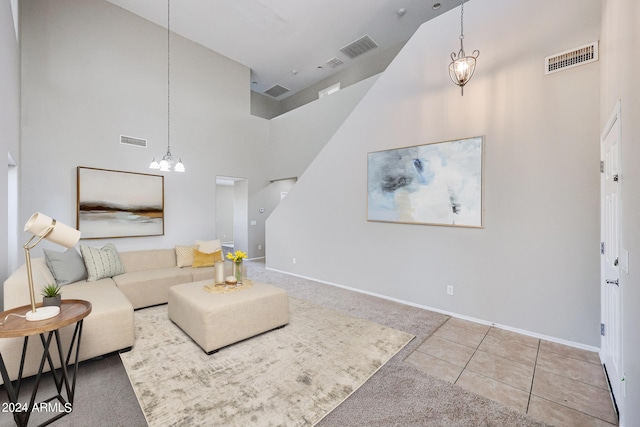 living room featuring light carpet and high vaulted ceiling