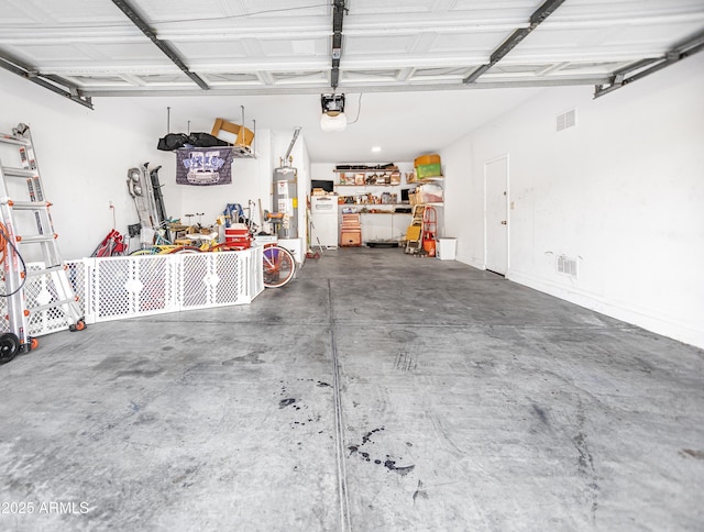 garage with water heater and a garage door opener