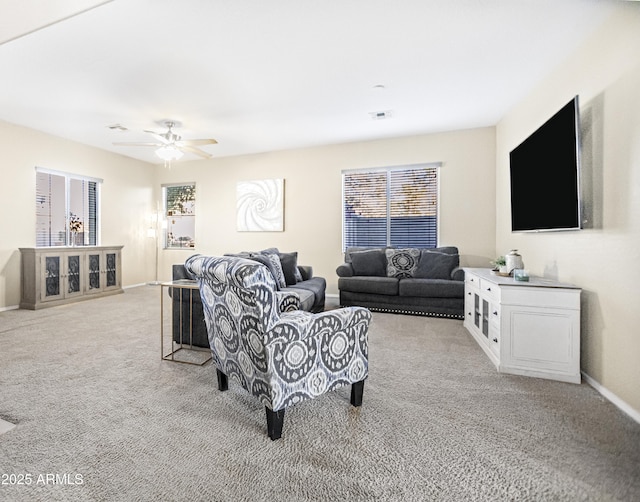 living room with ceiling fan and light carpet