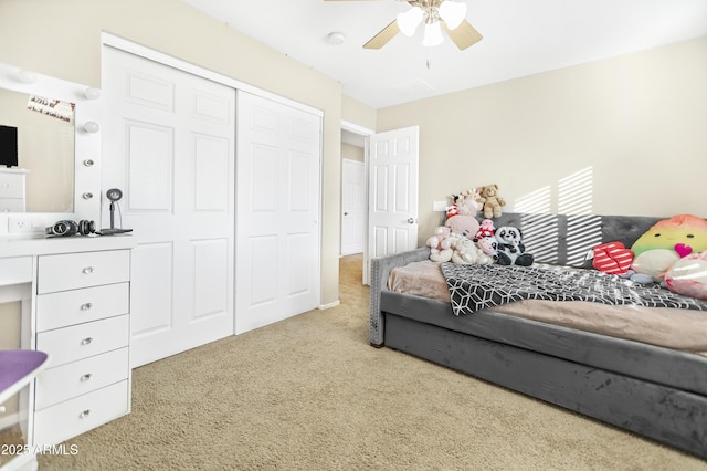 bedroom with a closet, carpet floors, and ceiling fan