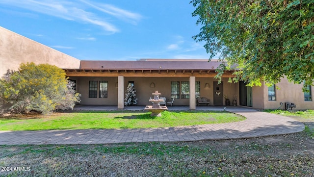 back of house with a patio area