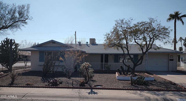 ranch-style home featuring a garage and a porch