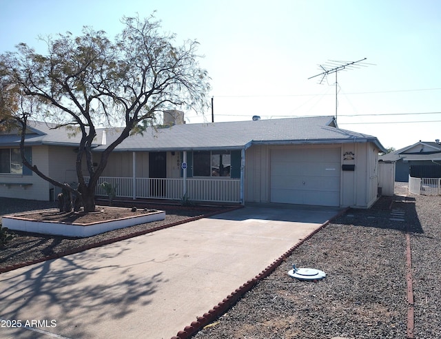 ranch-style house with a garage and covered porch